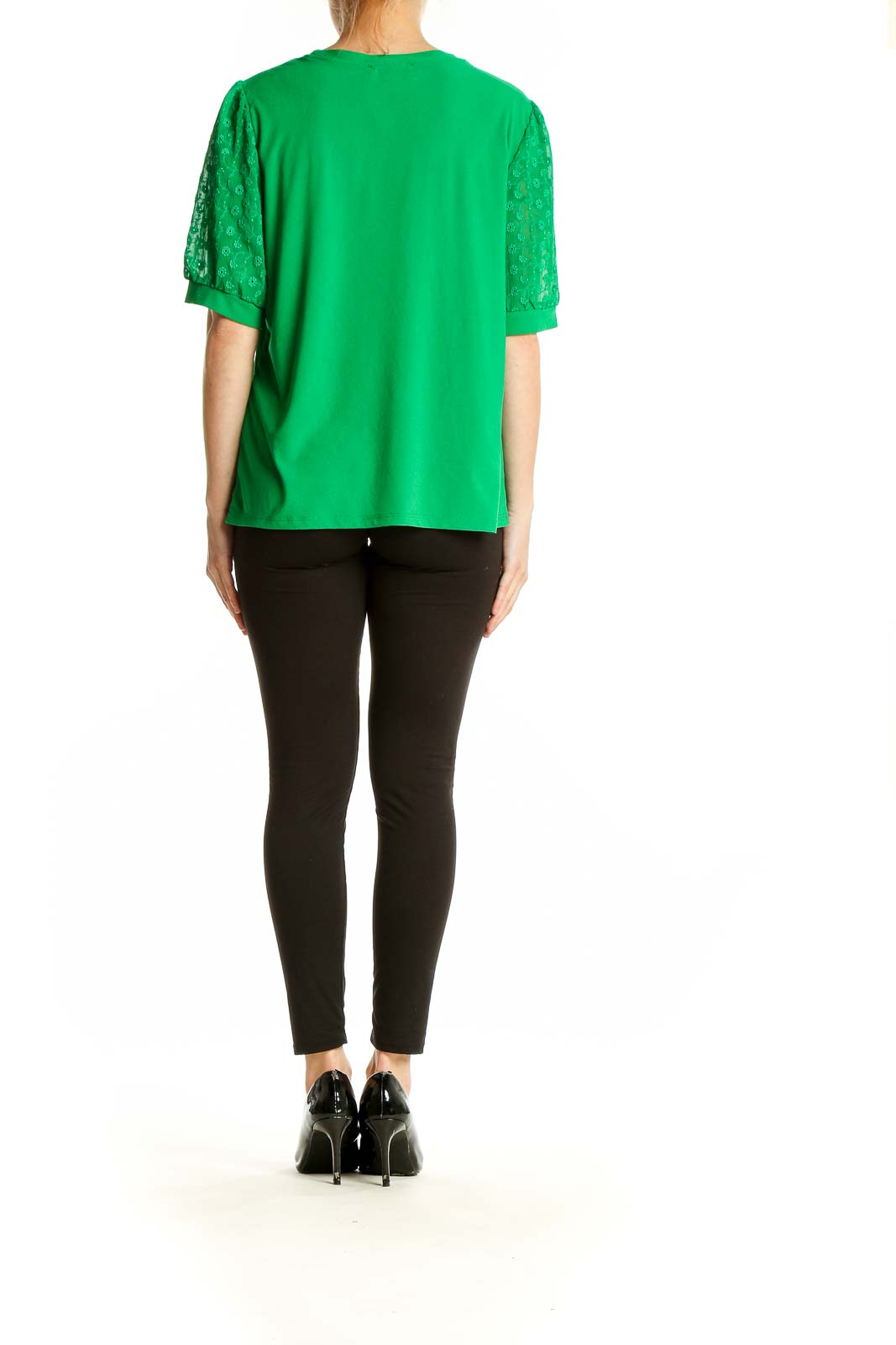 Side view of woman wearing CeCe green blouse with lace sleeves