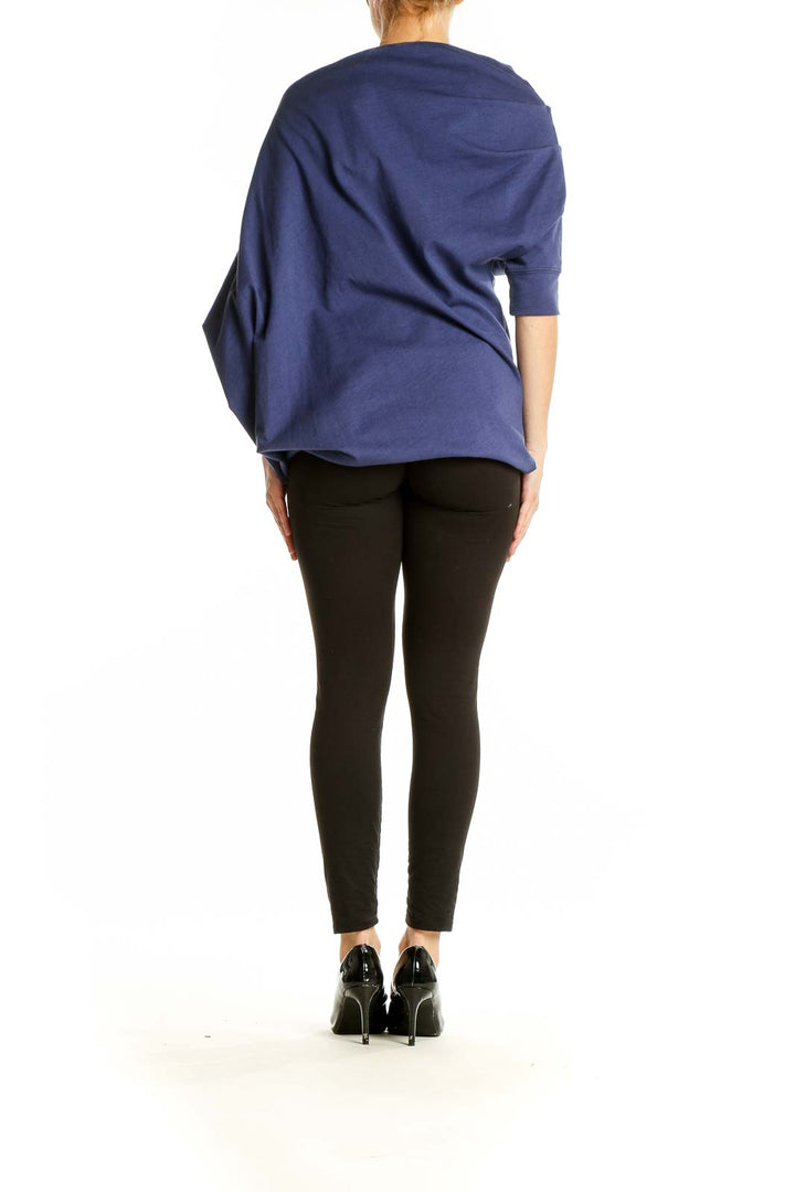 Side view of navy asymmetrical draped cotton top from FP Beach showing oversized fit