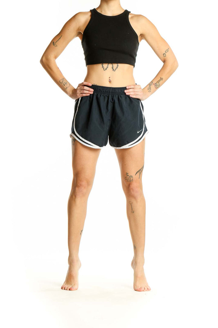 Front view of black Nike running shorts with white piping