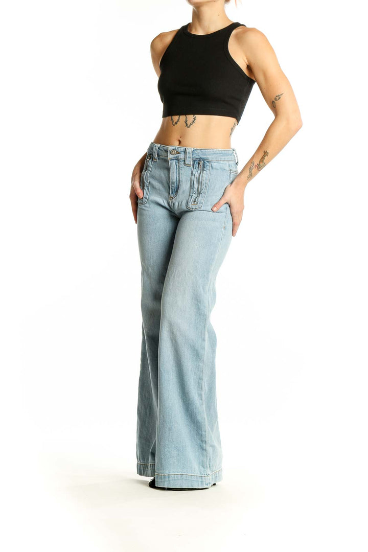 Front view of Pilcro and the Letterpress light blue wide-leg jeans with unique front pockets