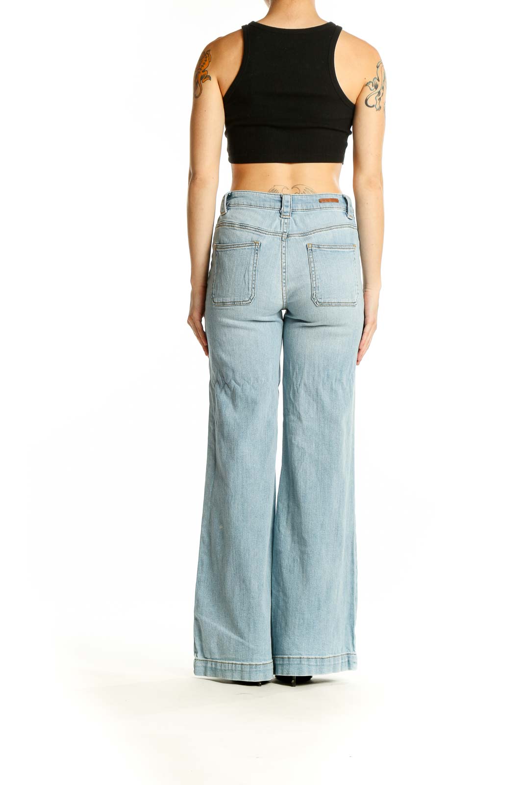 Back view of Pilcro and the Letterpress light blue wide-leg jeans on model