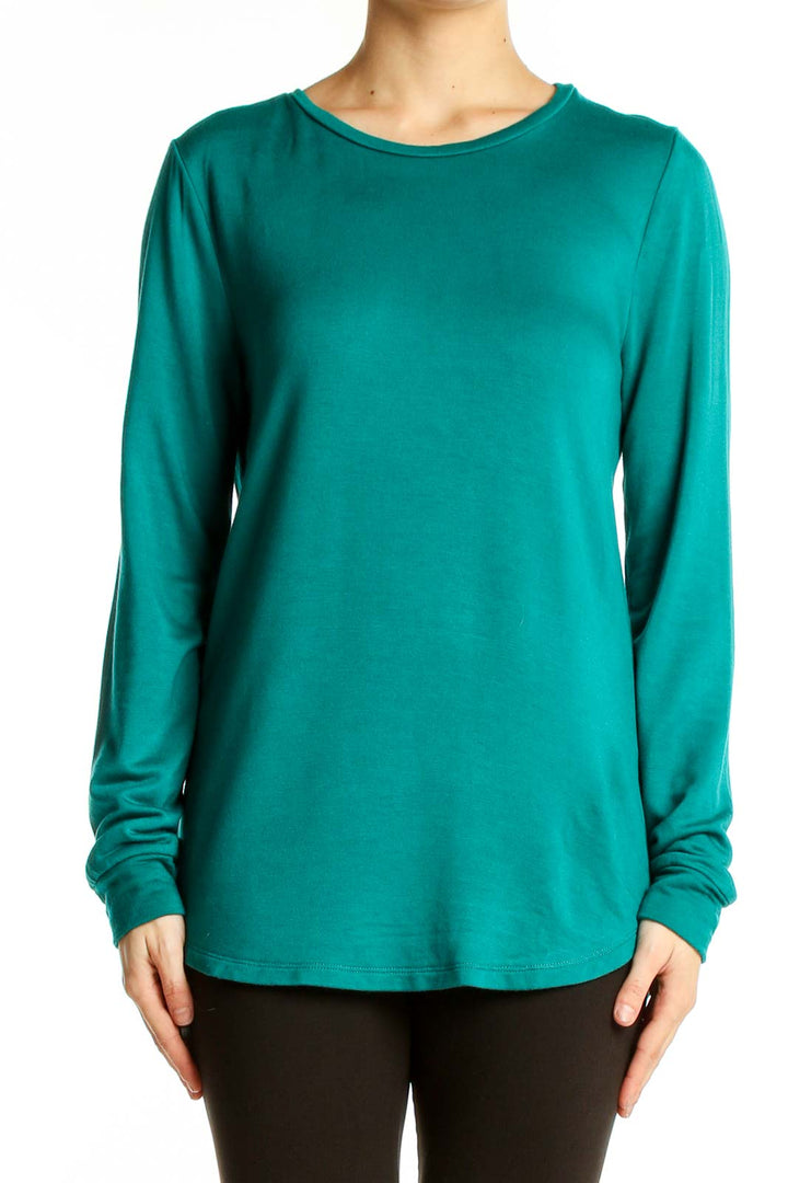 Front view of teal J.Crew long sleeve crewneck top on model