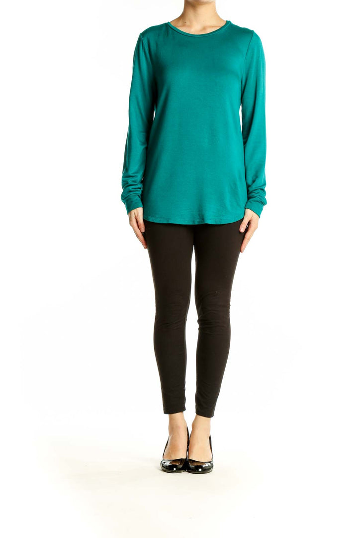 Front view of teal J.Crew long sleeve crewneck top on model