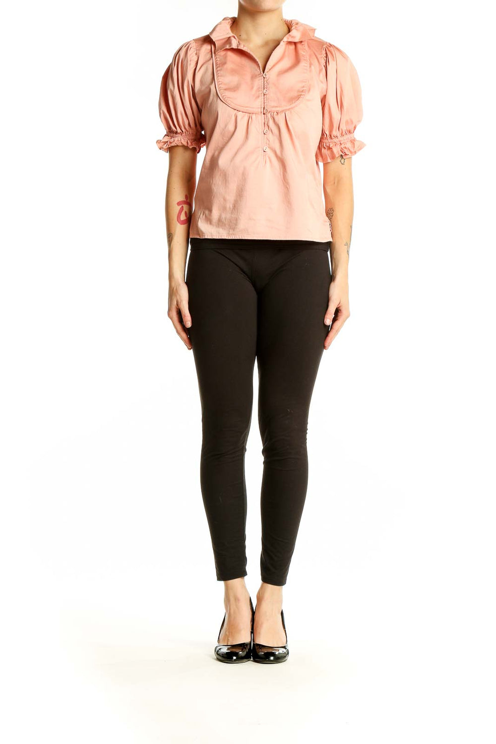 Front view of SEDGE peach puff-sleeve top with bib-front design