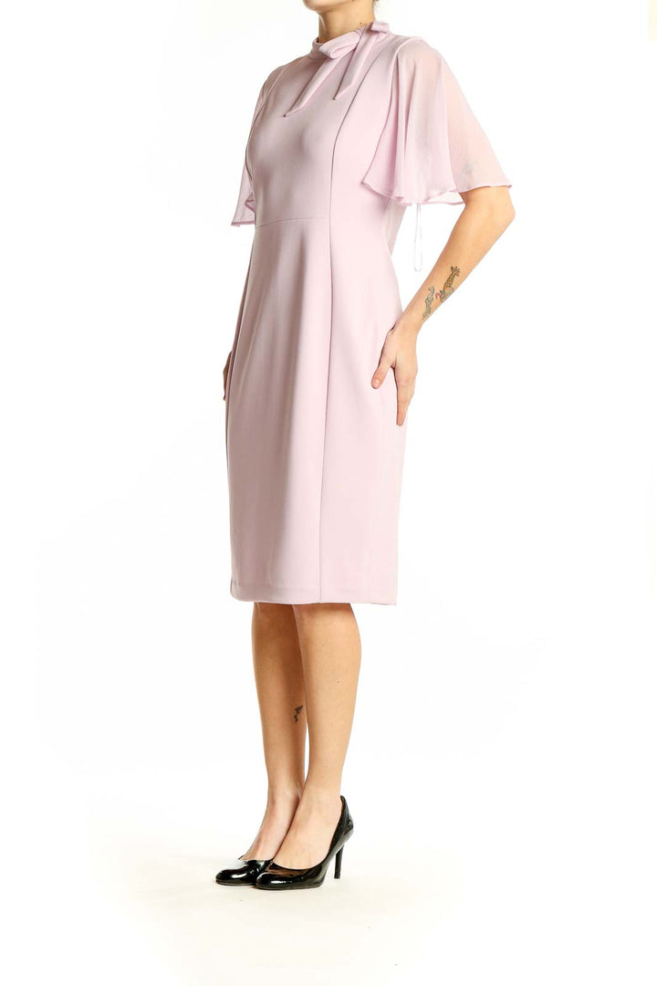 Front view of pink Calvin Klein sheath dress with flutter sleeves and tie neckline