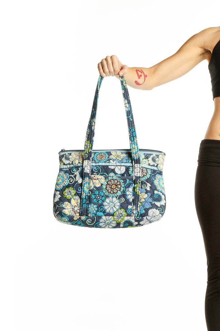 Front view of Vera Bradley blue floral cotton shoulder bag with quilted design