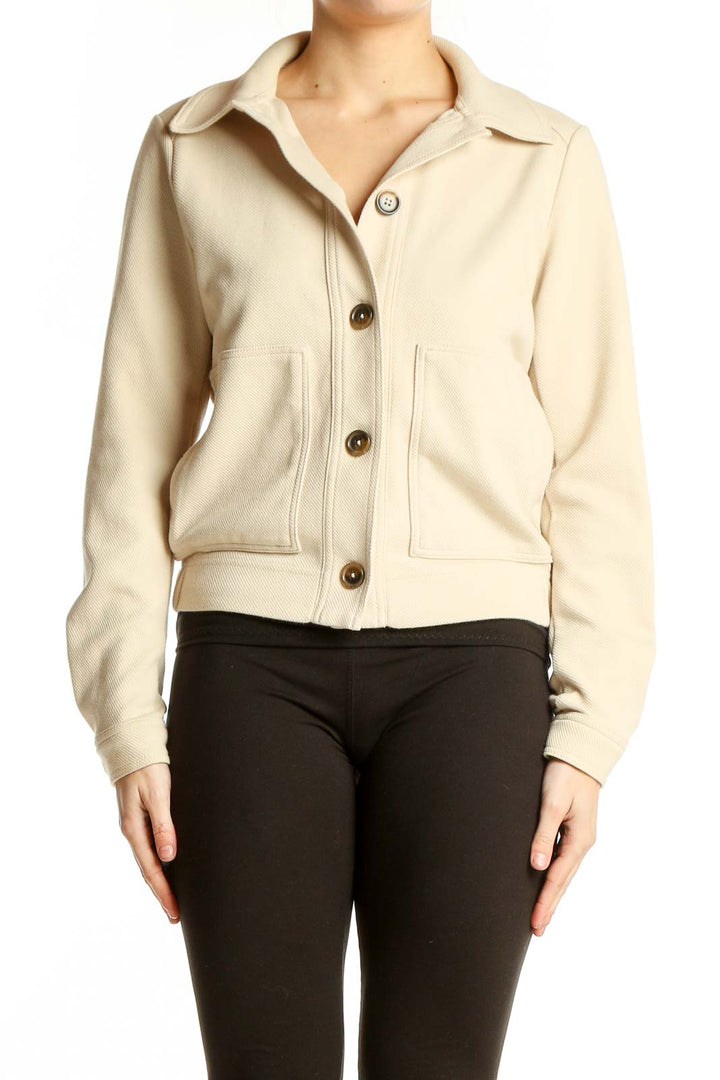 Front view of Banana Republic cream cropped jacket with button-up closure