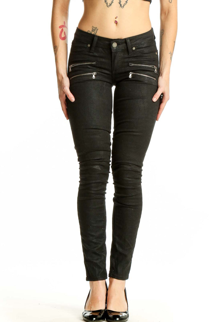 Front view of black Paige skinny jeans with zipper details