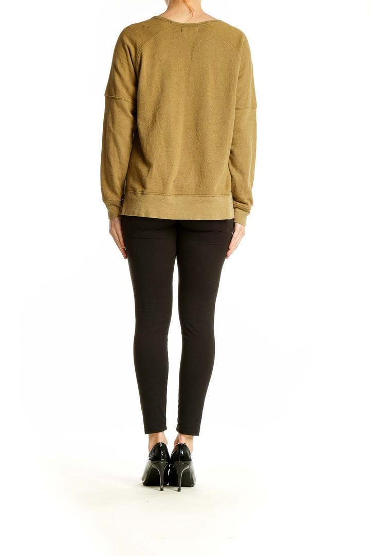 Back view of Madewell mustard raglan sleeve sweatshirt on model