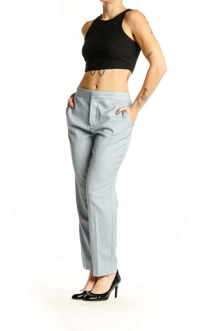 Front view of Zara light blue straight-leg trousers on model