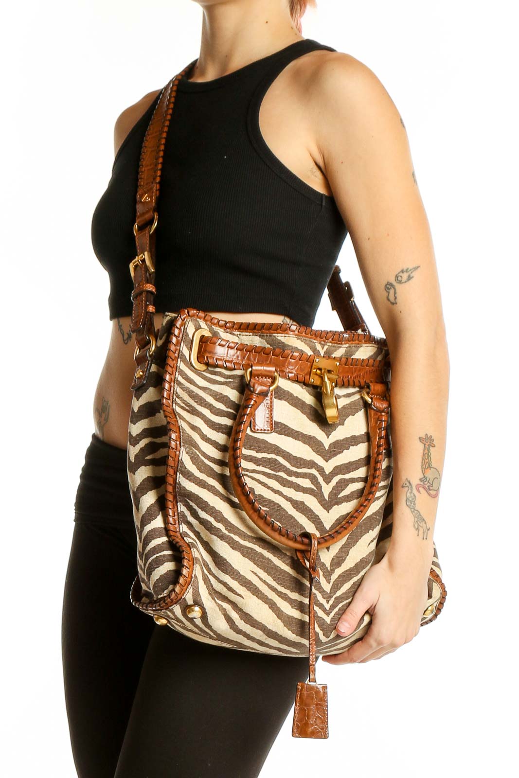 Front view of Michael Kors brown zebra print leather tote bag with cognac trim