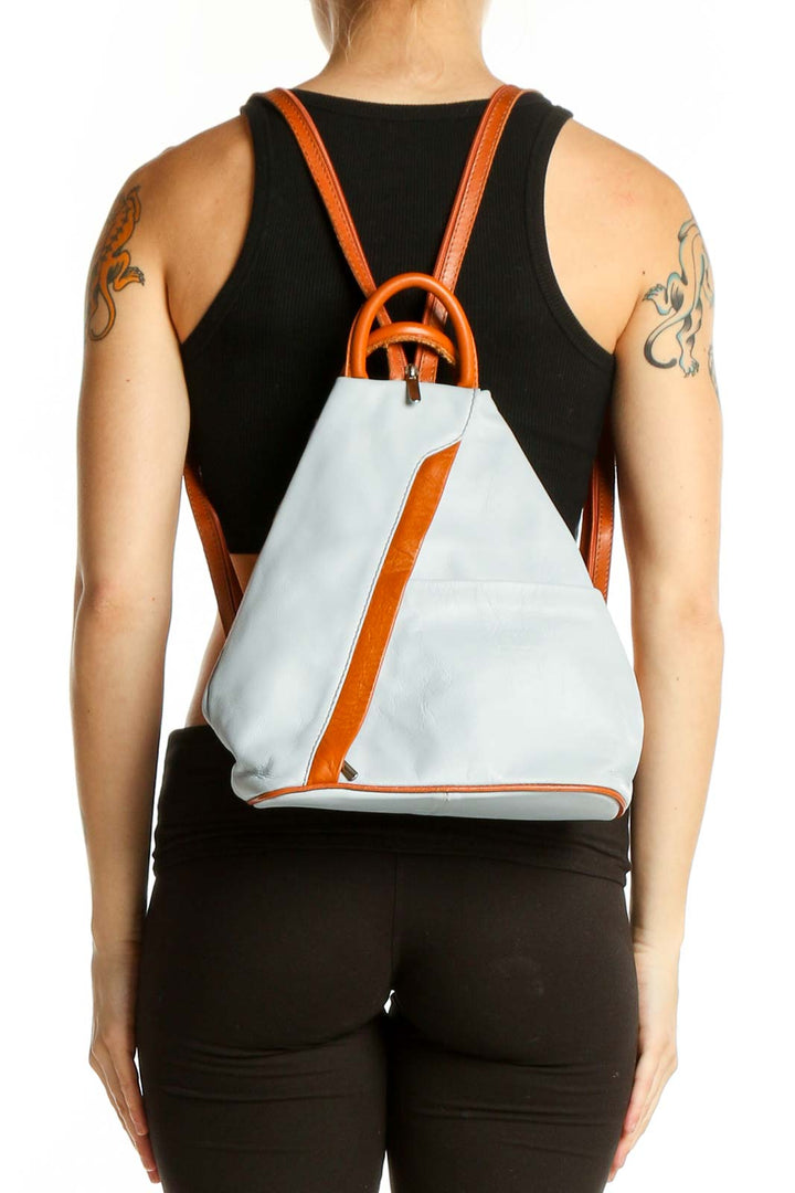 Front view of ZAGARA white and orange backpack with asymmetrical zipper