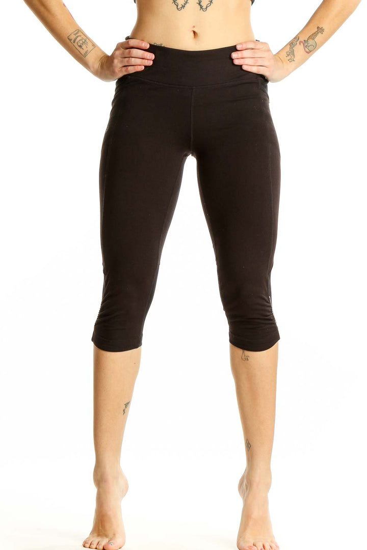 Front view of black Athleta cropped athletic leggings