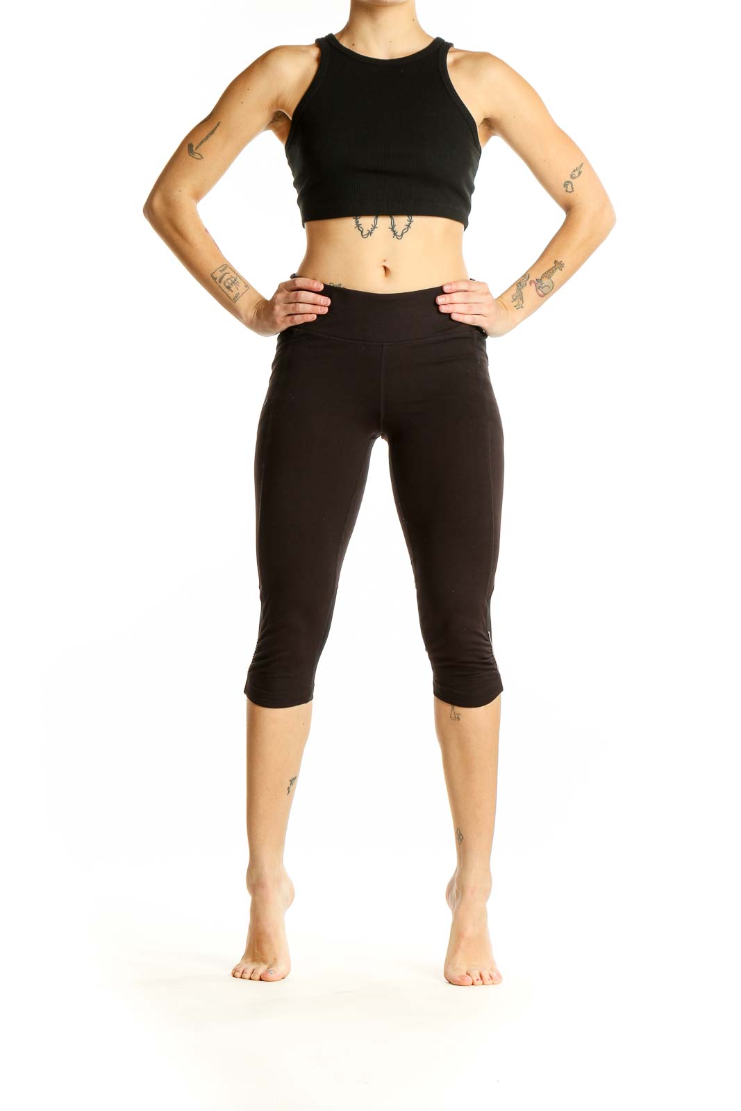 Front view of black Athleta cropped athletic leggings