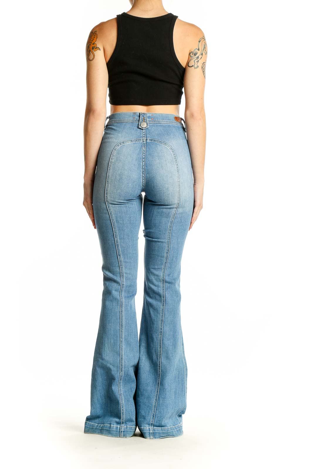 Back view of Ditto's light blue high-waisted flared jeans on model