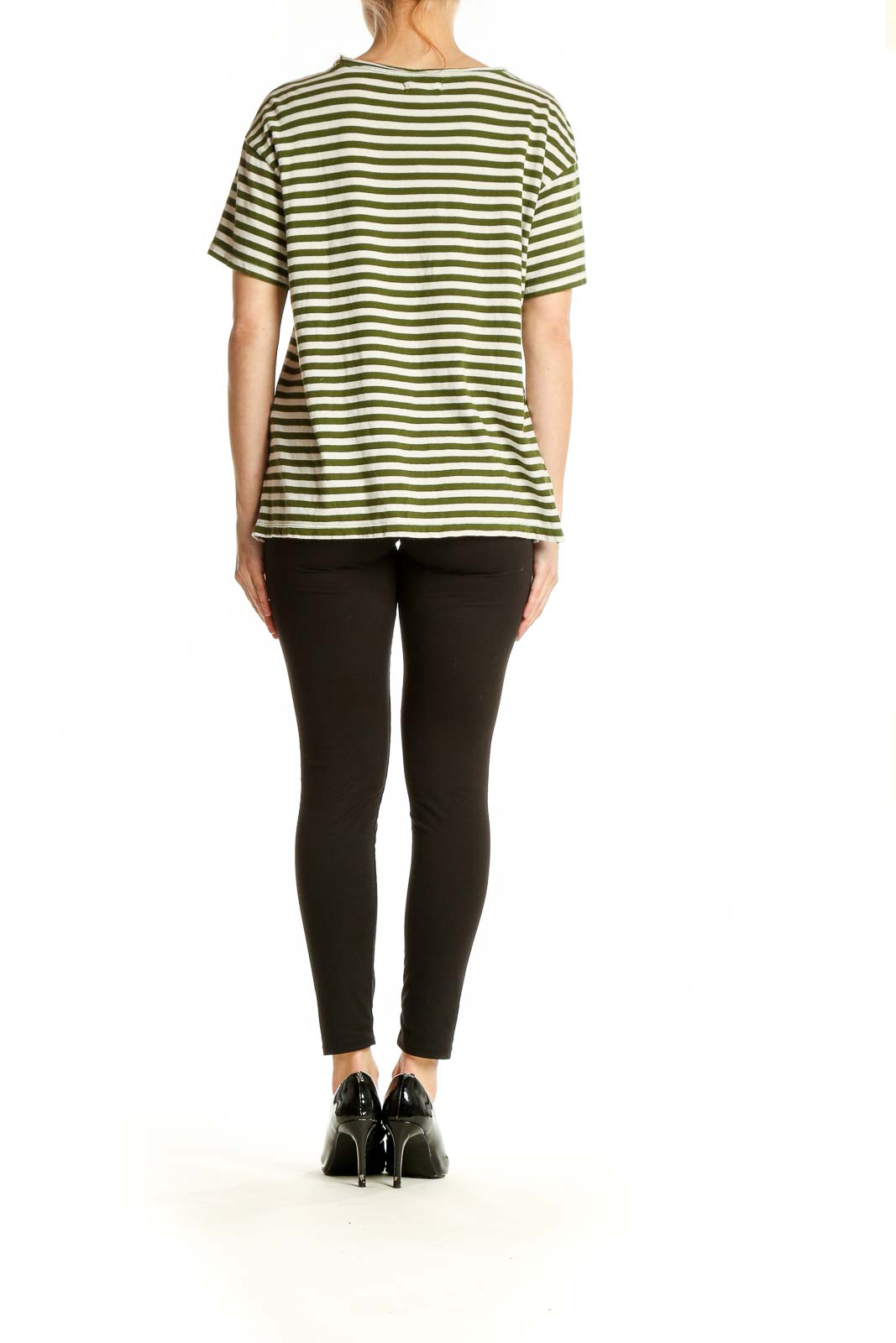 Side view of model wearing Madewell olive green striped t-shirt with black pants