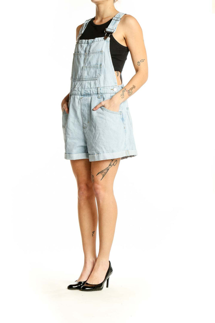 Front view of SilkRoll light blue denim short overalls with bib front pocket