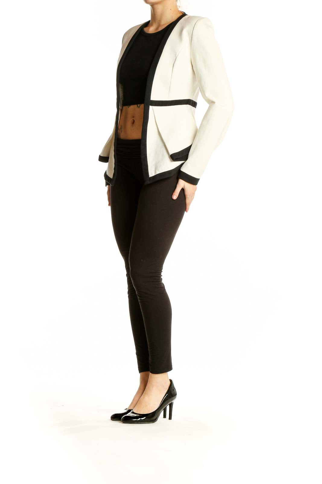 Front view of white Mossique blazer with black contrast trim and open front design