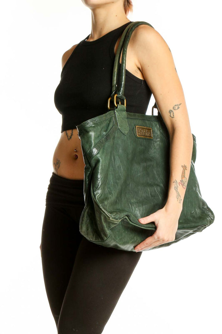 Front view of Junior Drake Love,d green leather tote bag