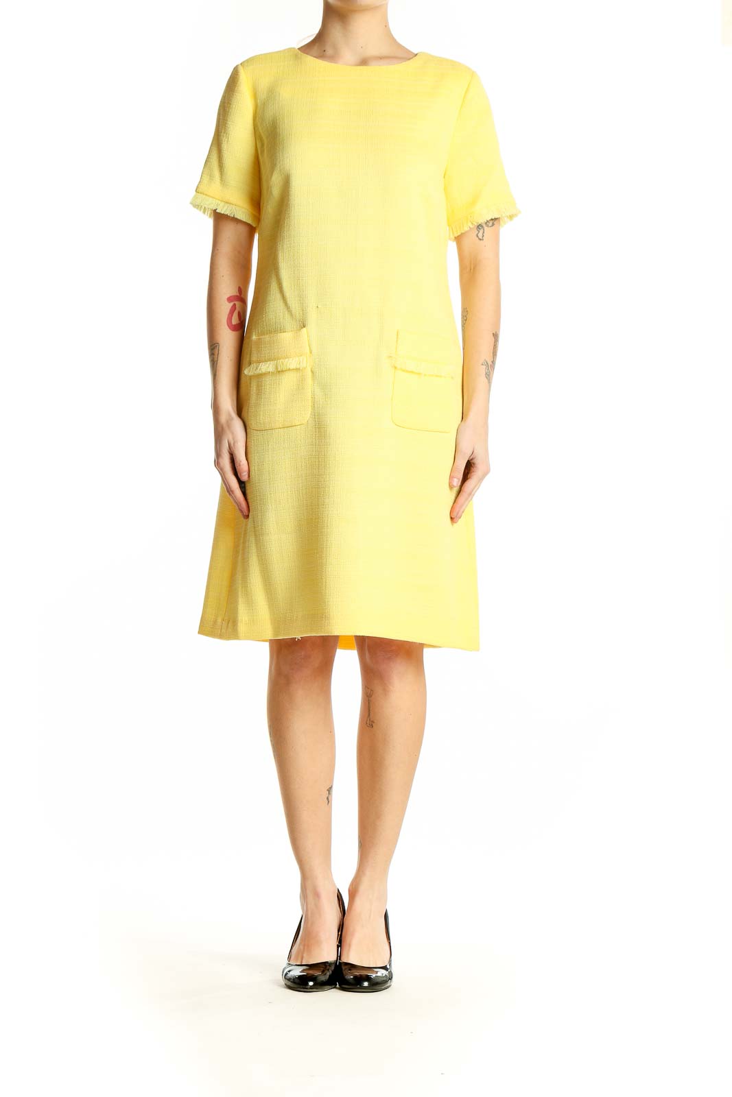 Front view of Tommy Hilfiger yellow textured shift dress with frayed edges and front pockets