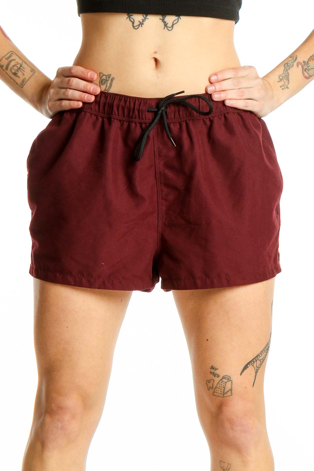 Front view of burgundy ASOS athletic shorts with elastic waistband