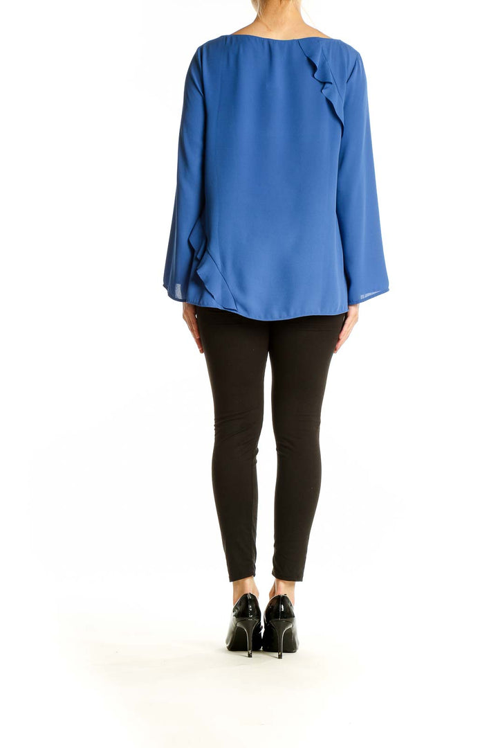 Side view of blue Banana Republic blouse showing flowy silhouette