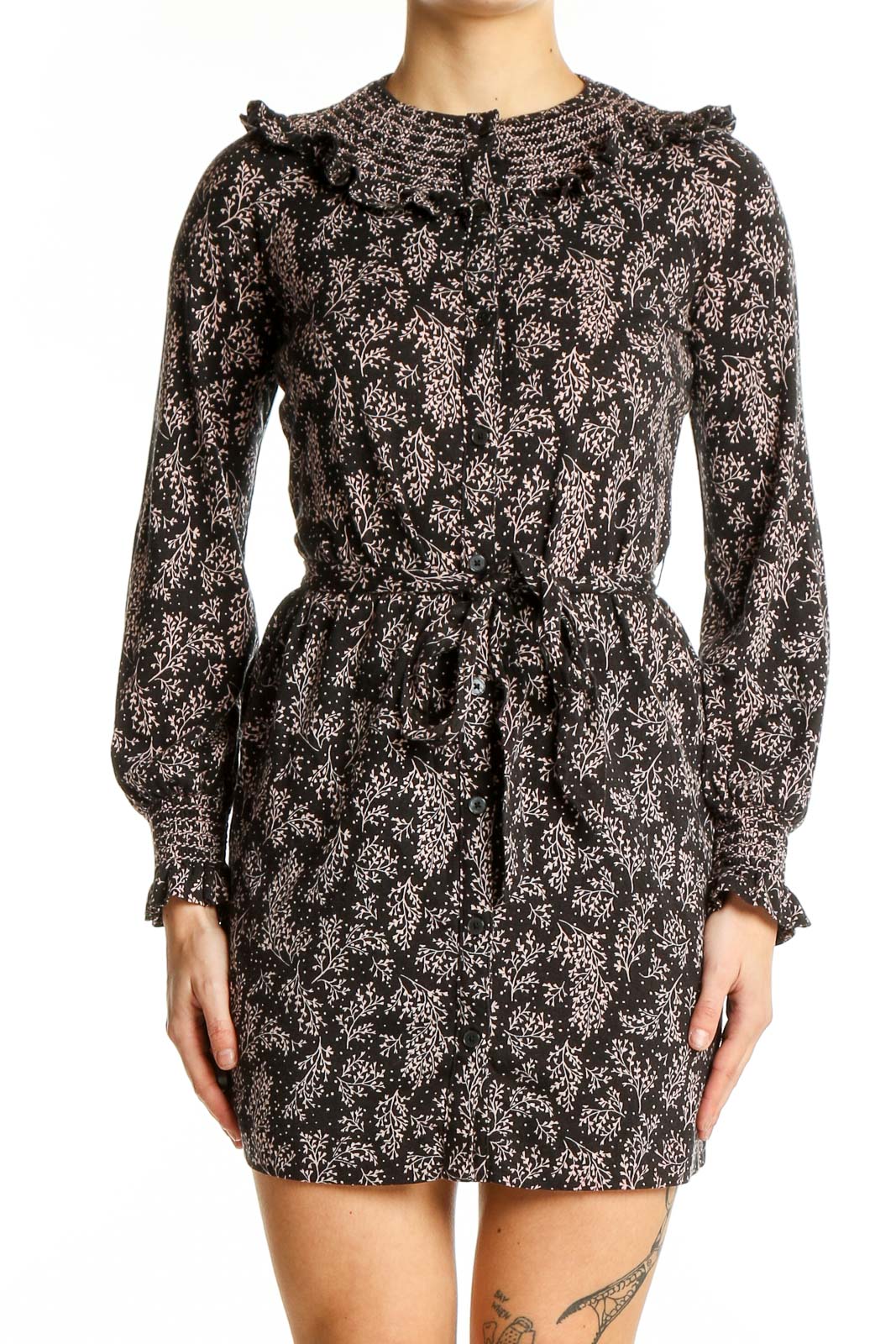 Front view of black floral Boden mini dress with ruffle collar and waist tie