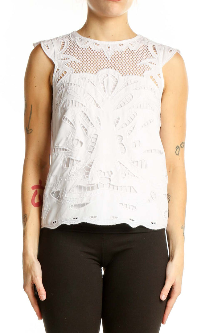 Front view of White House Black Market white lace sleeveless blouse with floral pattern