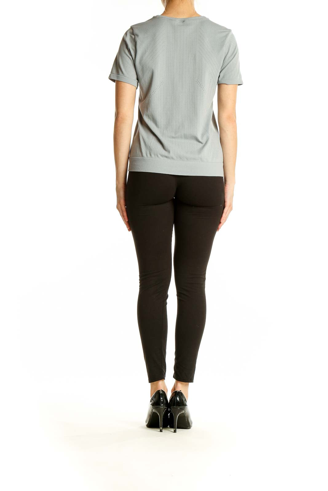 Side view of gray textured Athleta performance short sleeve top on model