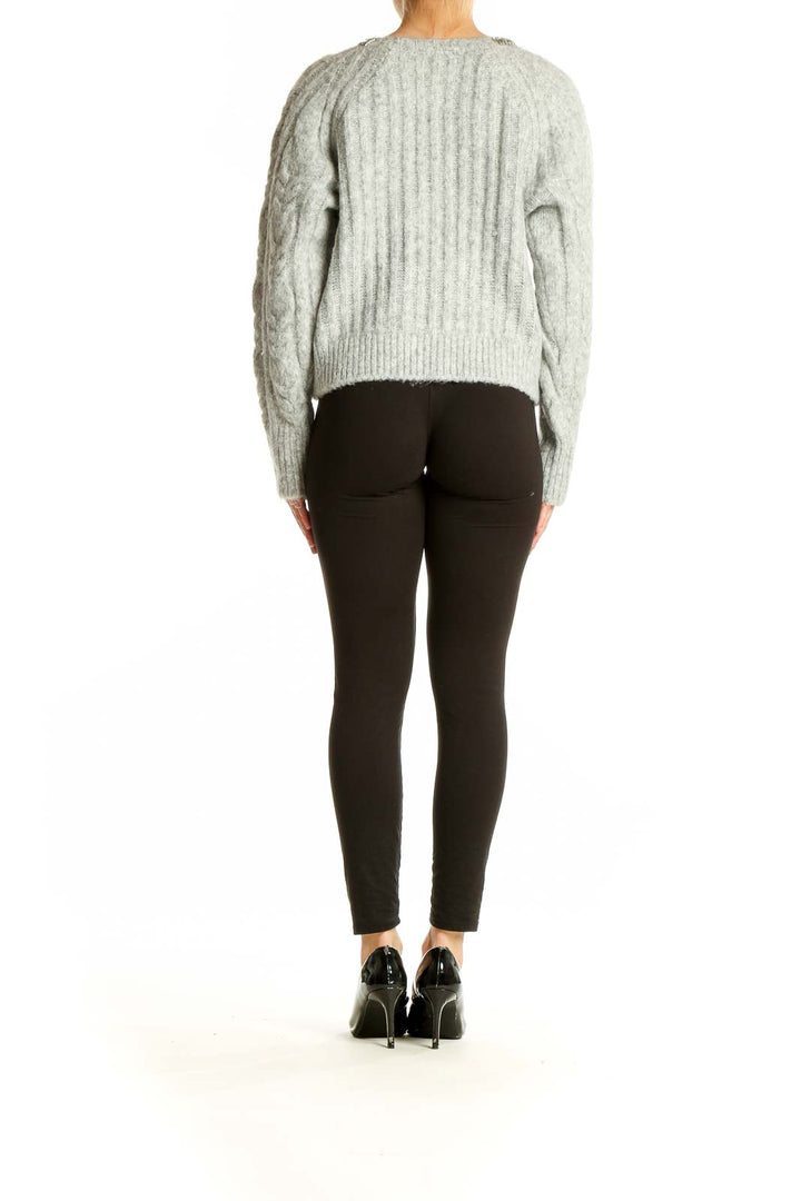 Side view of Express gray cable knit sweater showing relaxed fit and length