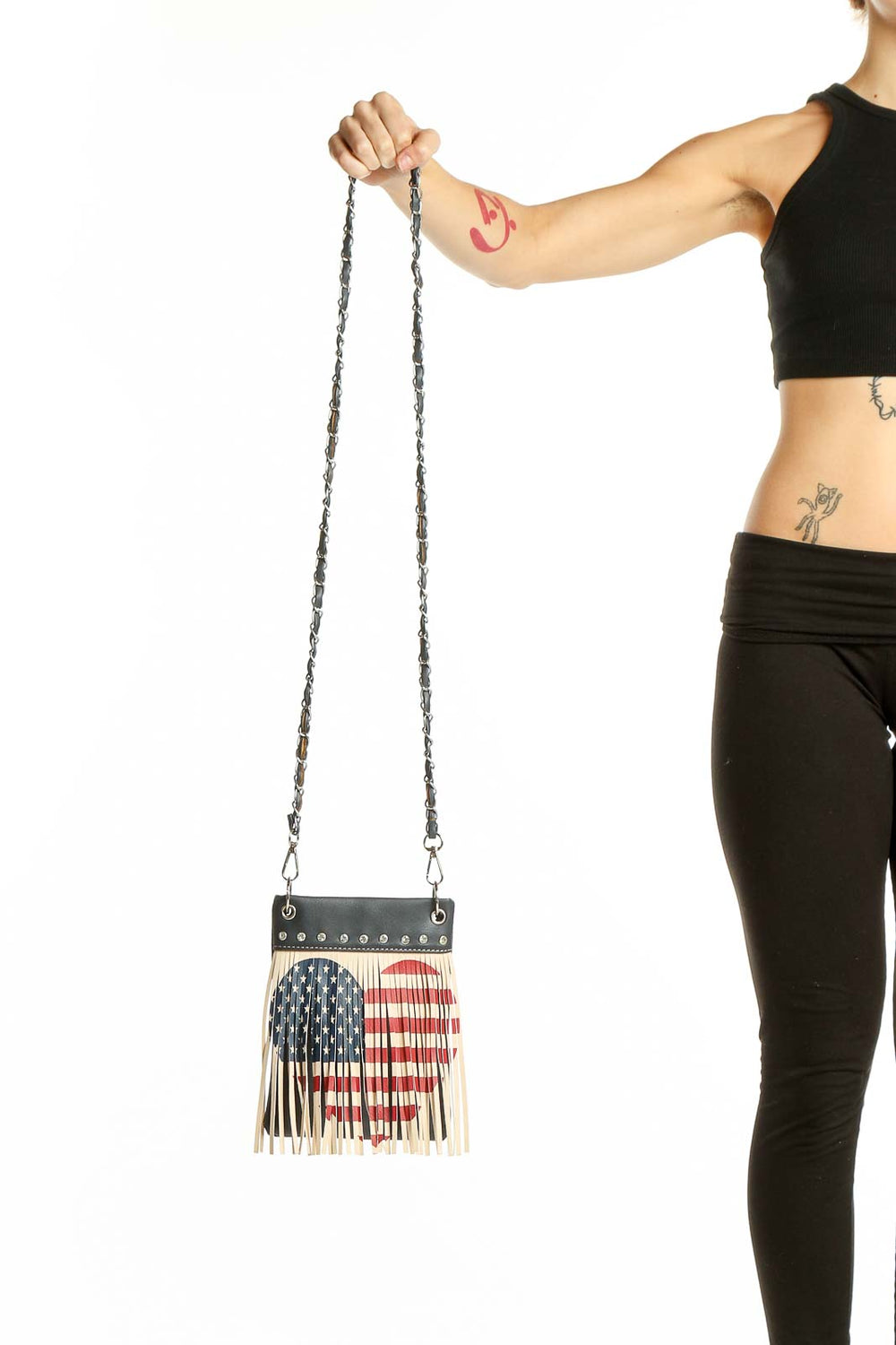 Front view of SilkRoll American flag fringe crossbody bag with chain strap