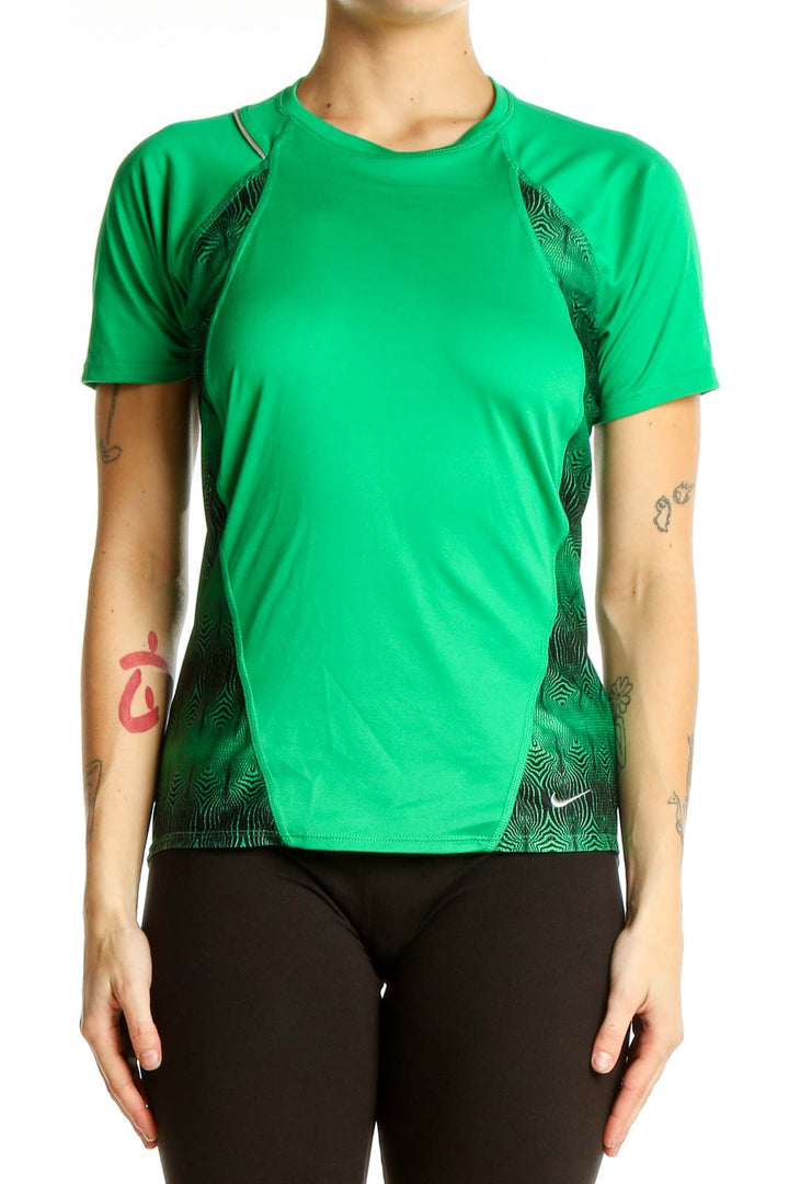 Front view of green Nike athletic t-shirt with black geometric side panels