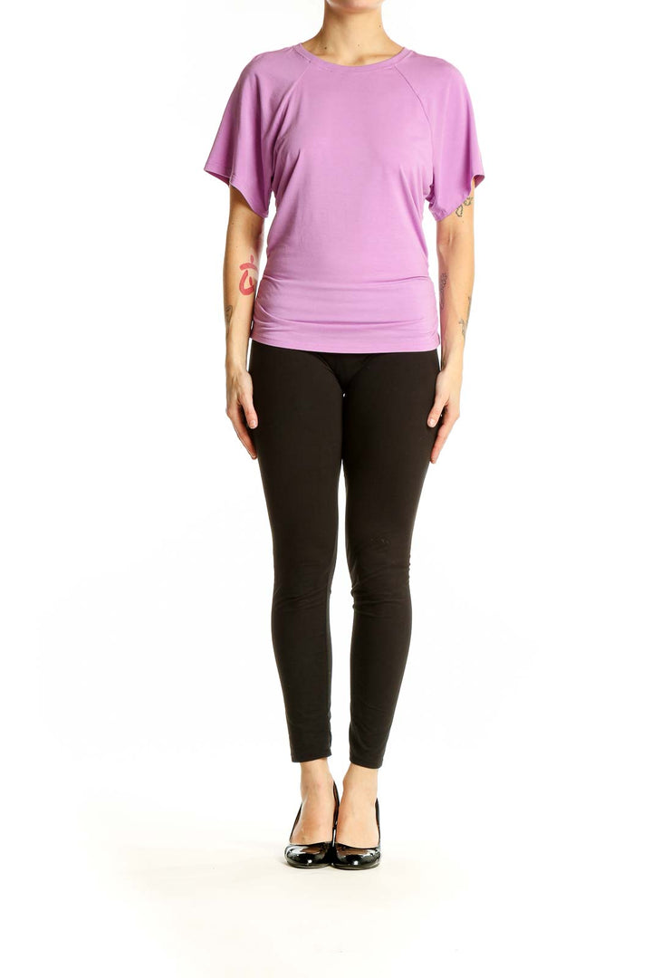 Front view of lavender Athleta activewear top with relaxed fit and short sleeves