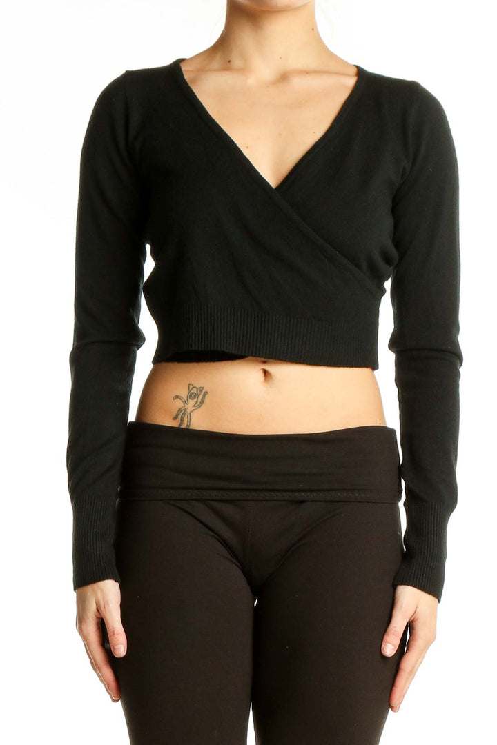 Front view of black wrap-style cropped sweater by Dreamers by debut