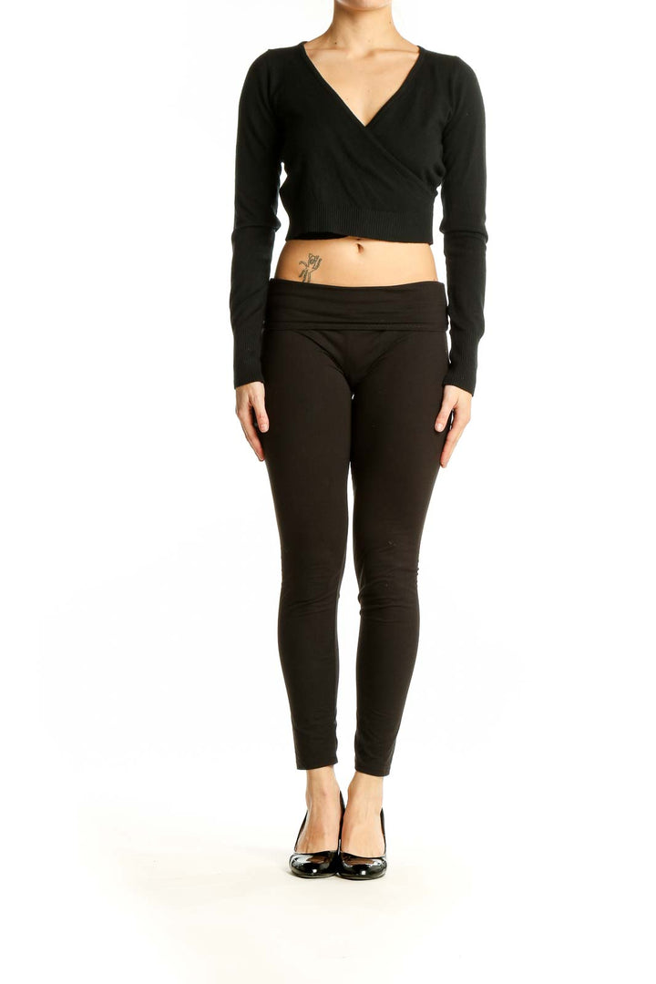 Front view of black wrap-style cropped sweater by Dreamers by debut