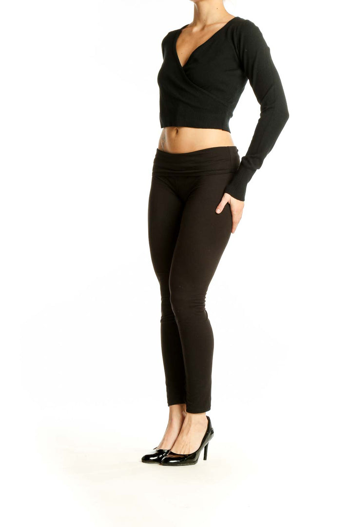 Front view of black wrap-style cropped sweater by Dreamers by debut