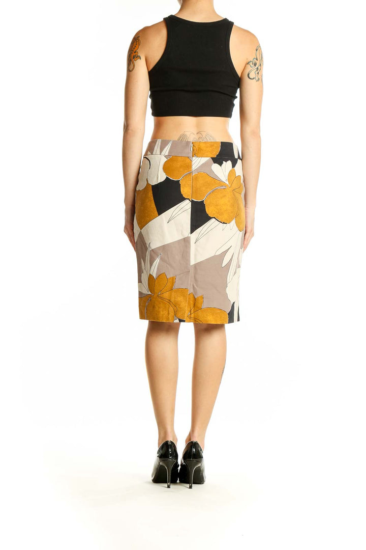 Side view of Ann Taylor mustard floral print pencil skirt on model