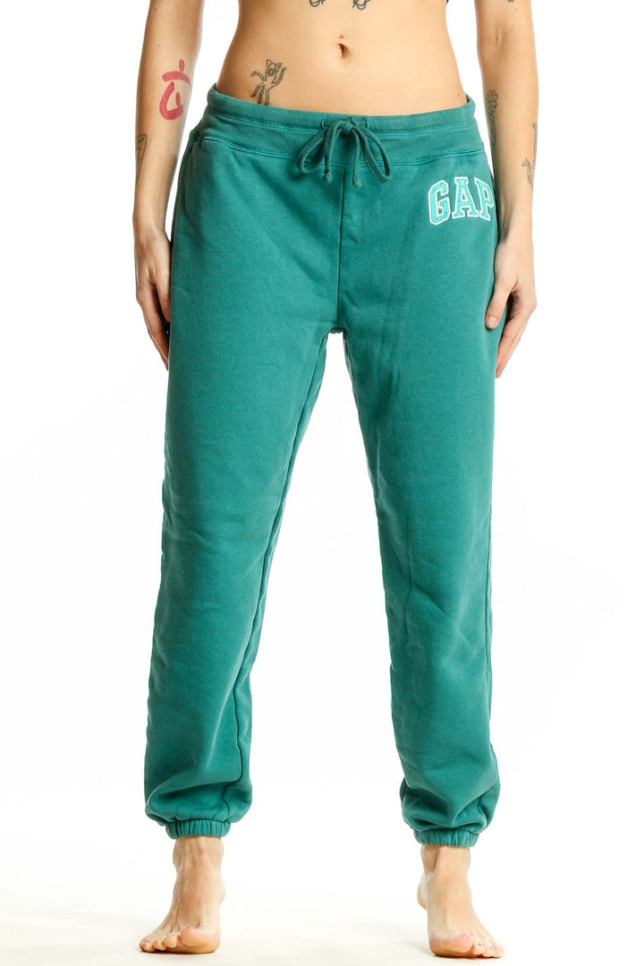 Front view of teal Gap sweatpants with drawstring waist