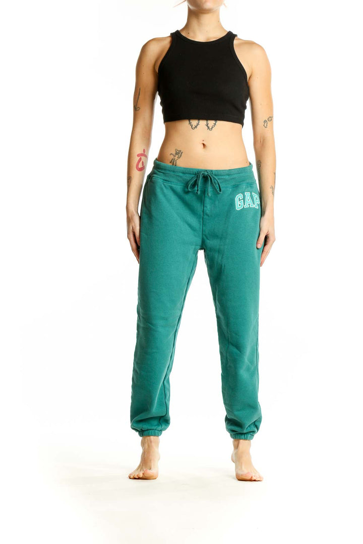 Front view of teal Gap sweatpants with drawstring waist