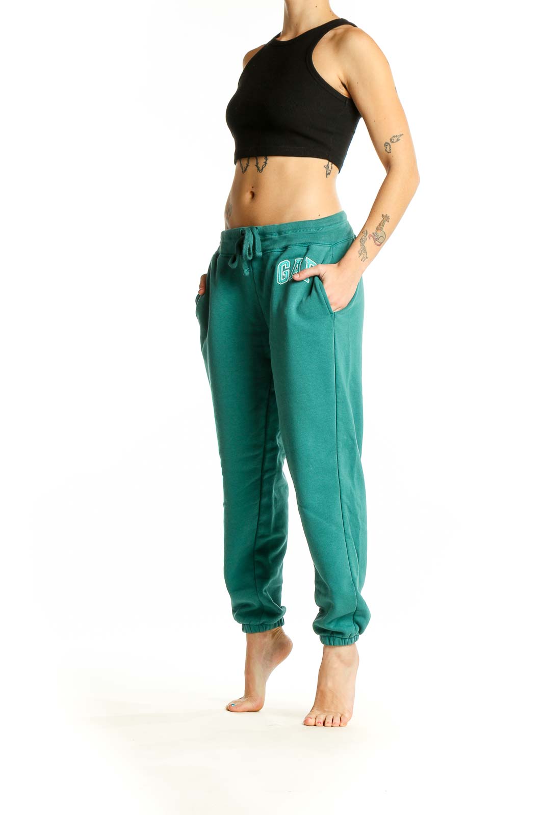 Front view of teal Gap sweatpants with drawstring waist