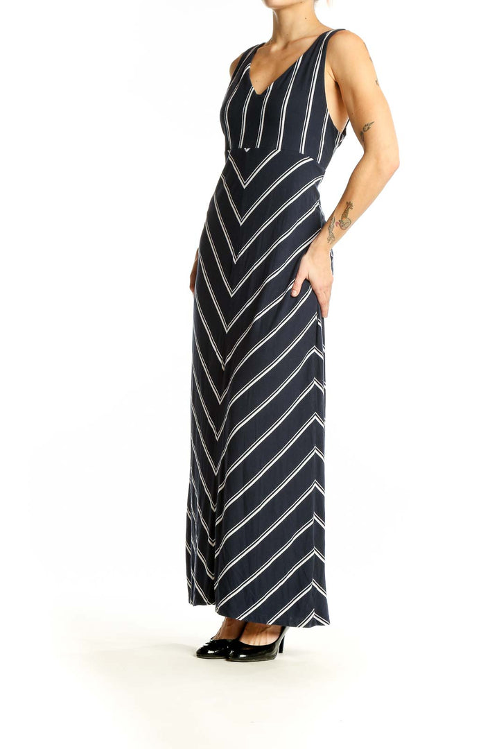 Front view of Athleta navy striped V-neck maxi dress with chevron pattern