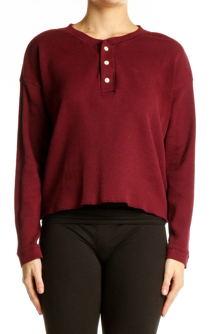 Front view of Everlane burgundy cotton henley knit top with button detail