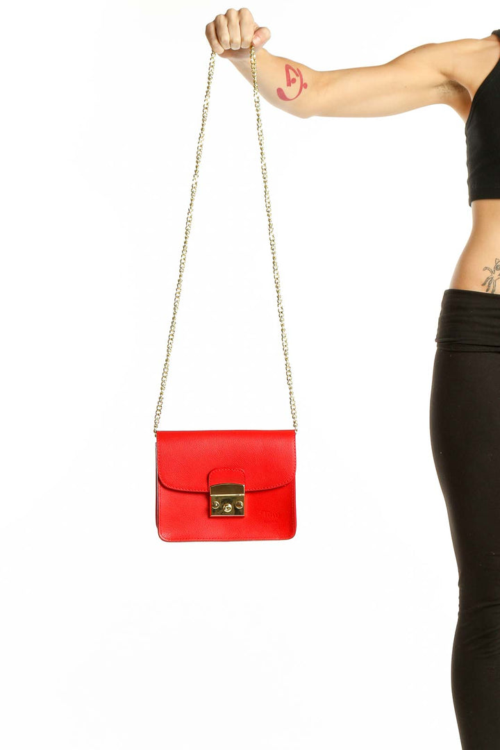 Front view of Toro Firenze red leather crossbody bag with gold chain