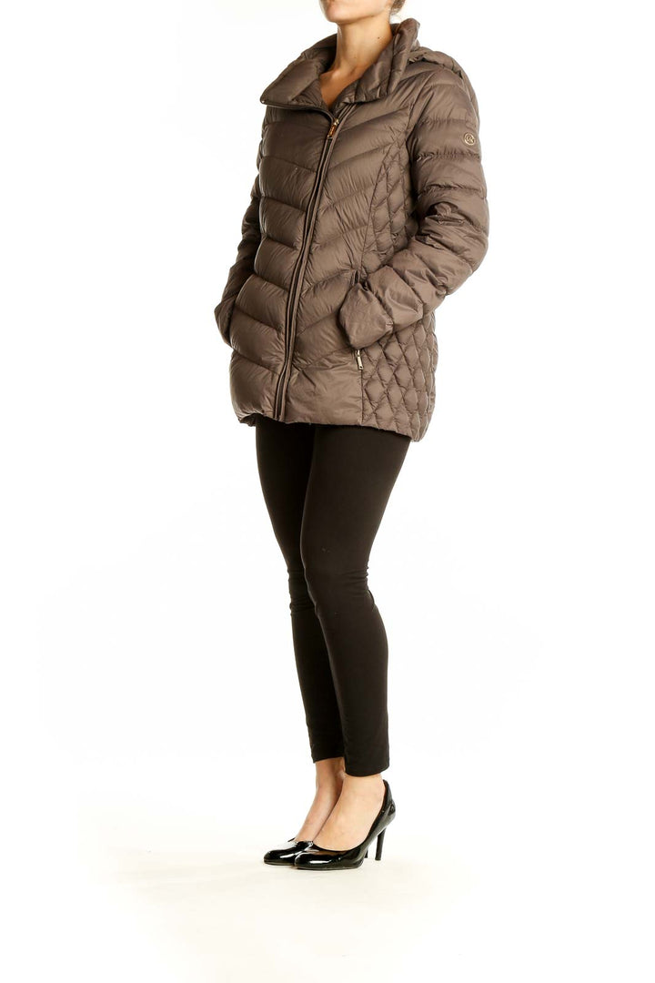 Front view of Michael Kors brown quilted nylon puffer jacket with asymmetrical zip