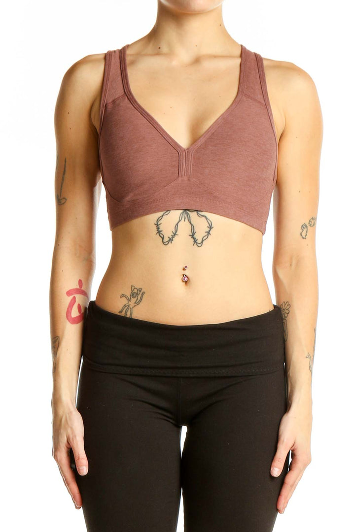 Front view of mauve racerback sports bra by Beyond Yoga