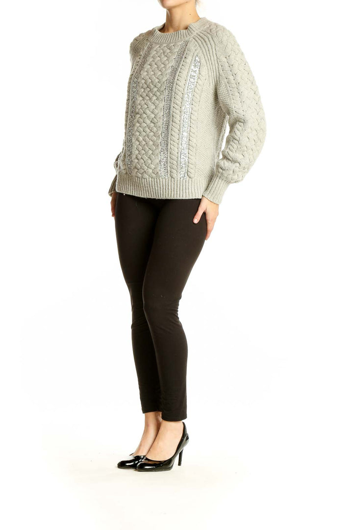 Front view of J.Crew beige cable knit sweater with sequin embellishments