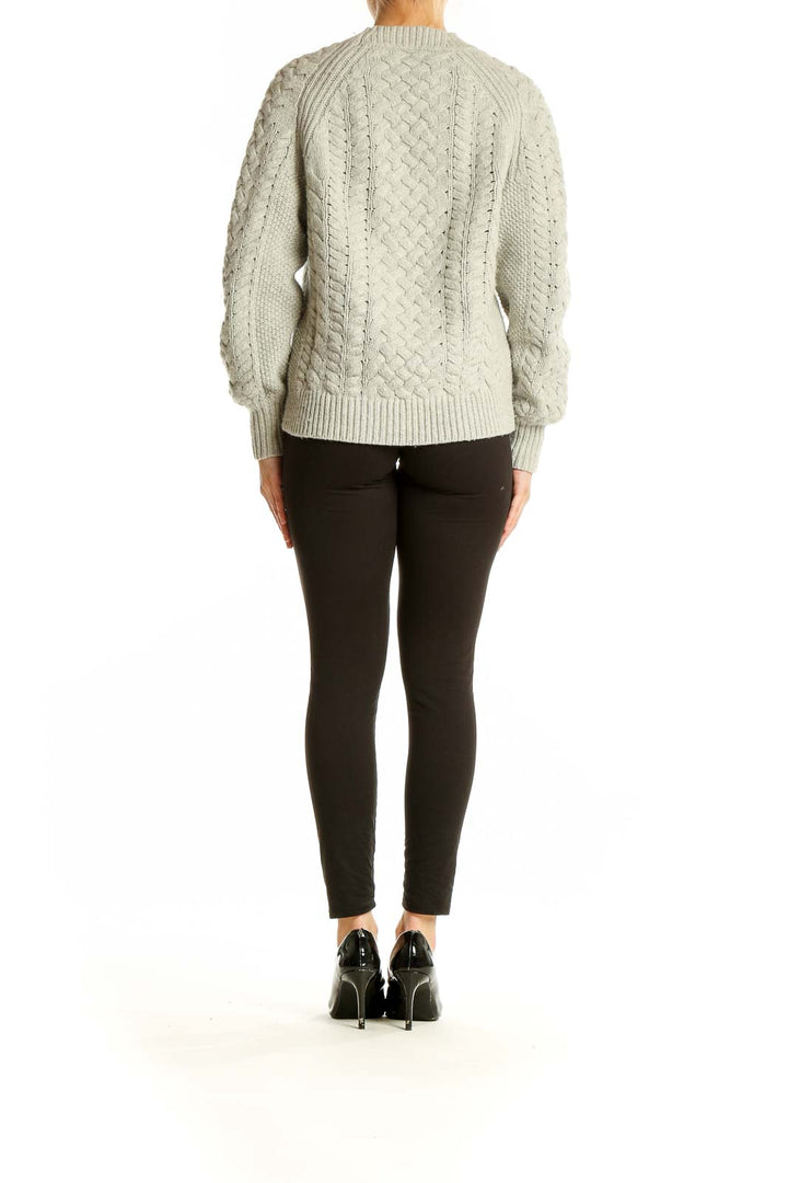 Back view of J.Crew beige cable knit sweater showing relaxed fit