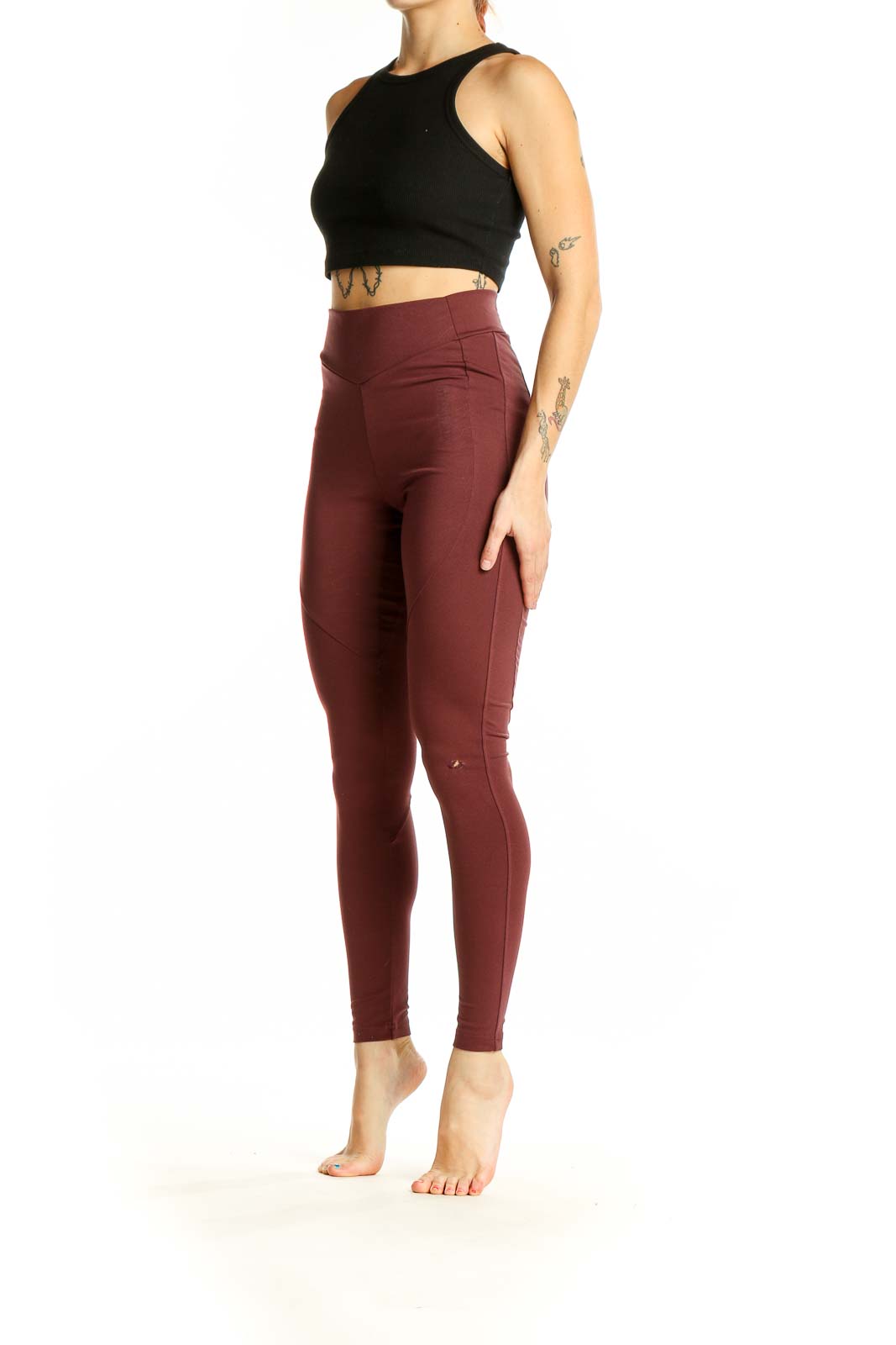 Front view of burgundy Gymshark high-waisted leggings on model