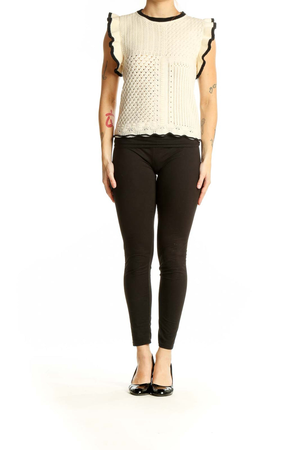 Front view of cream sleeveless knit top with ruffled armholes and mixed knit patterns