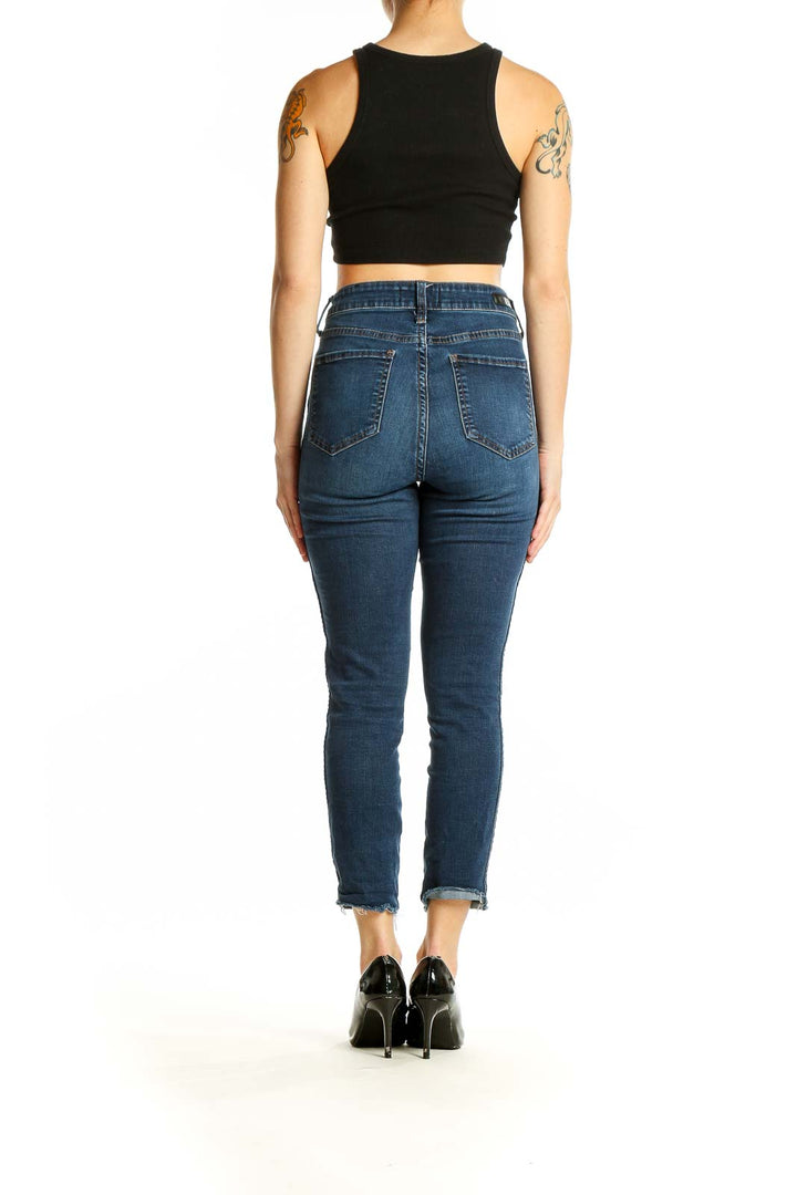 Back view of KUT from the Kloth dark blue high-rise cropped skinny jeans on model